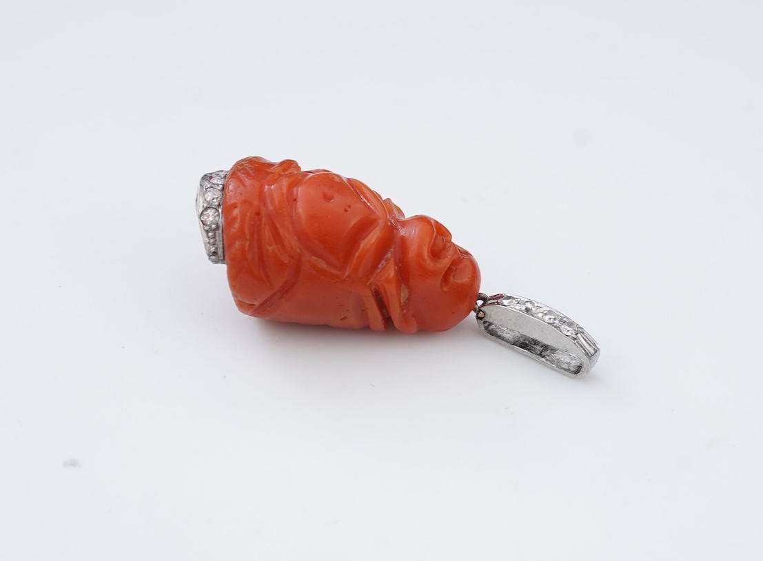 An Art Deco carved coral and diamond pendant, 1920s